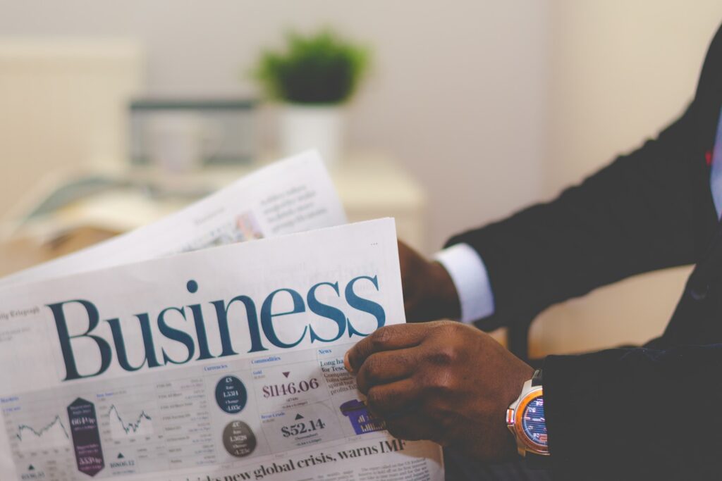 Businessman opening a paper